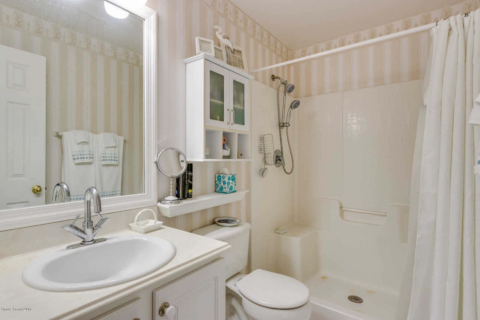 2009 Redwood Circle Palm Bay, FL 32905 - Photo 22 of 32 a bathroom with a sink toilet and shower