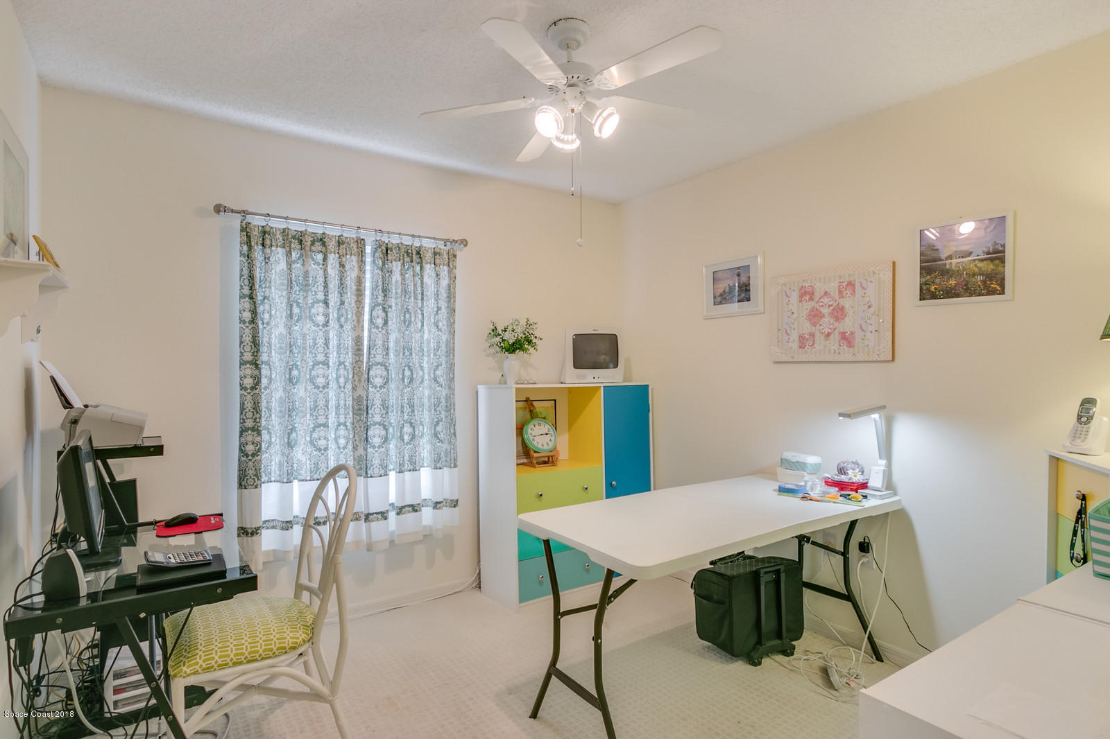 2009 Redwood Circle Palm Bay, FL 32905 - Photo 24 of 32 a view of a dining room with furniture and a chandelier
