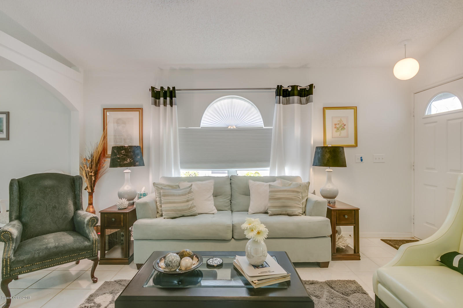 2009 Redwood Circle Palm Bay, FL 32905 - Photo 31 of 32 a living room with furniture and a large window