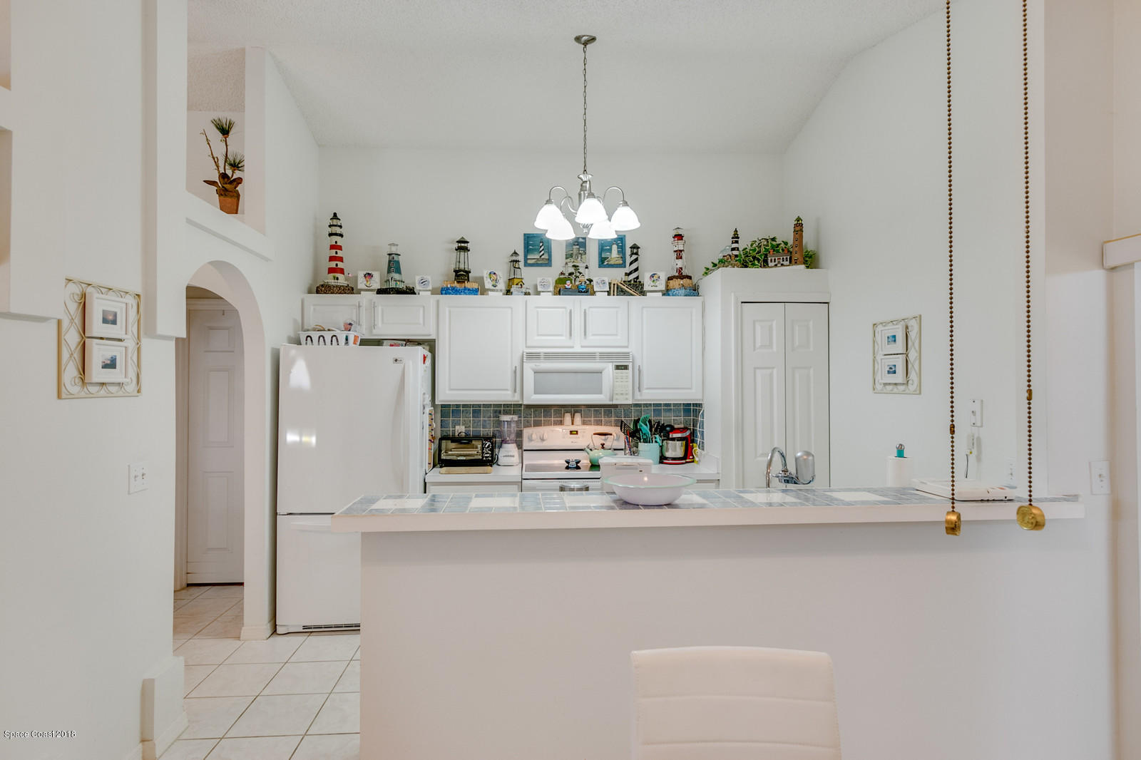 2009 Redwood Circle Palm Bay, FL 32905 - Photo 32 of 32 a kitchen with refrigerator and cabinets