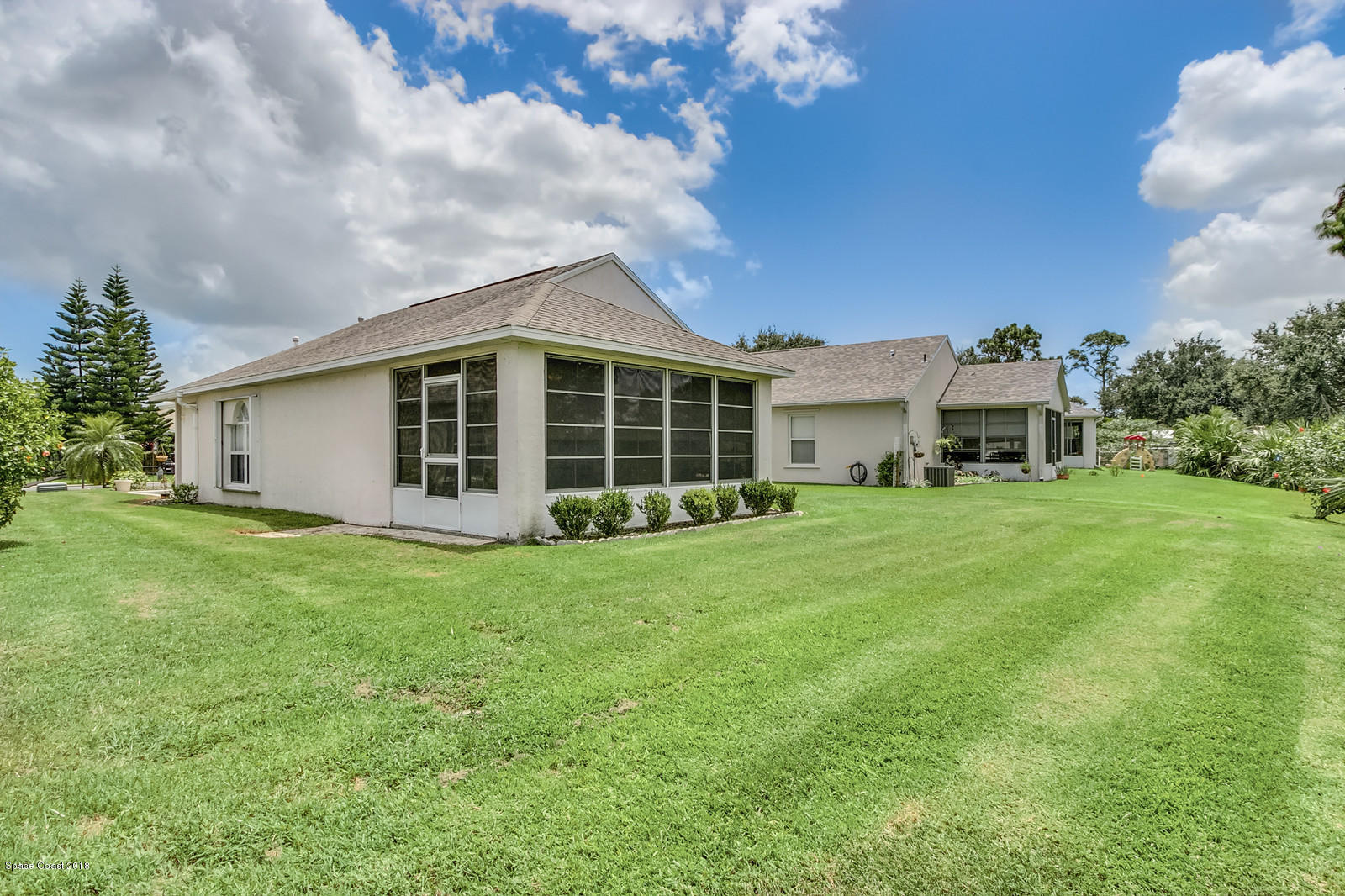 2009 Redwood Circle Palm Bay, FL 32905 - Photo 5 of 32 a view of a house with a backyard