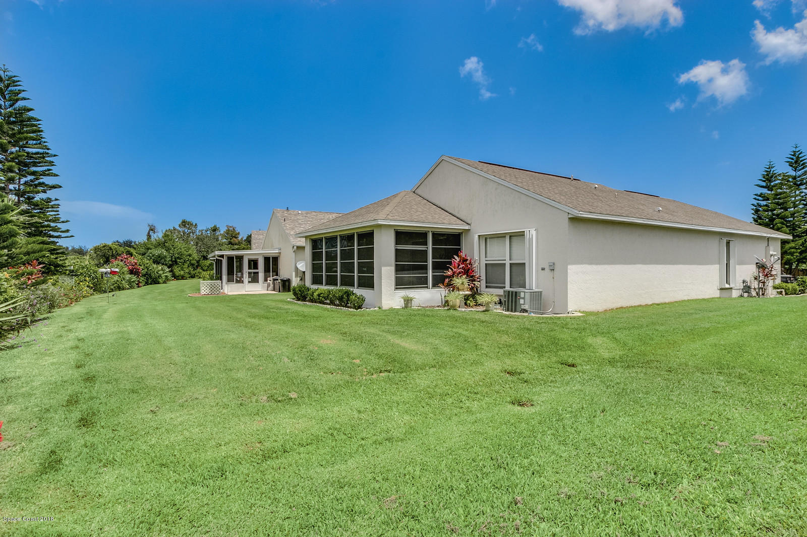 2009 Redwood Circle Palm Bay, FL 32905 - Photo 6 of 32 a view of a house with a backyard