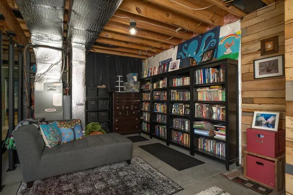 a bedroom with furniture and a chandelier