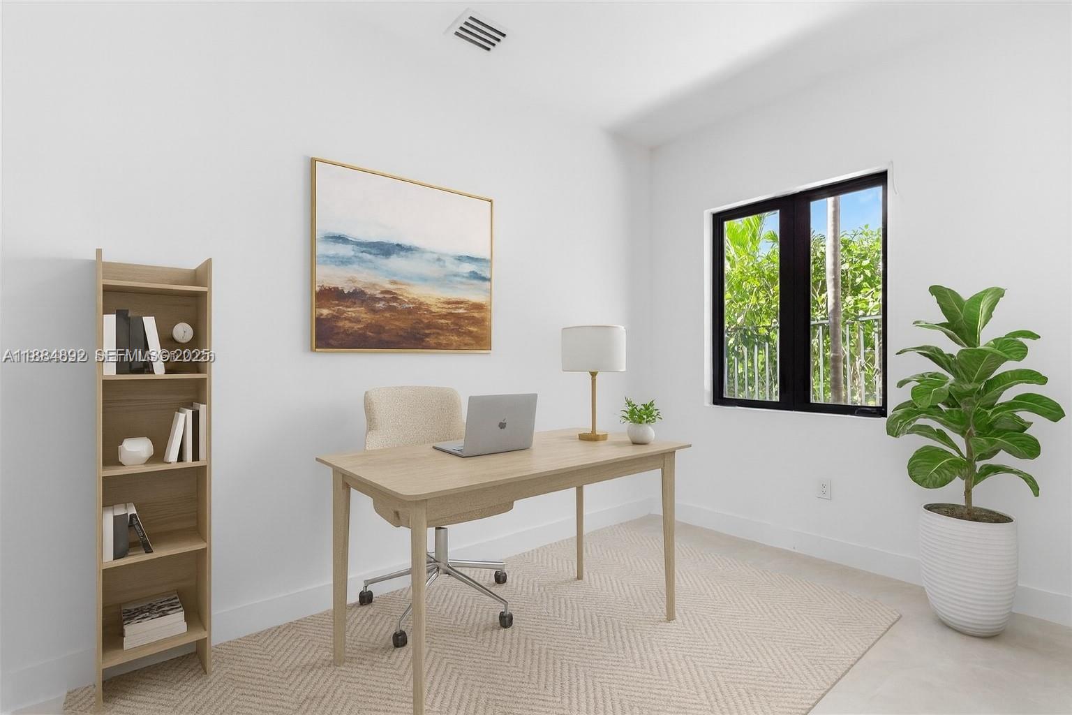 2523 Red Road Miami, FL 33134 - Photo 12 of 39 a view of a workspace with furniture and a potted plant