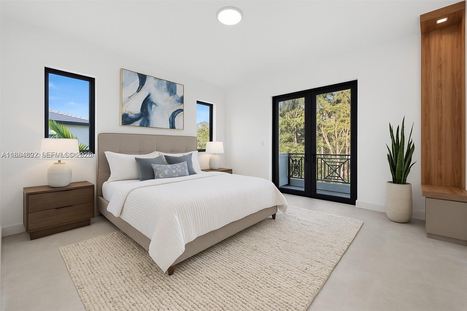 2523 Red Road Miami, FL 33134 - Photo 22 of 39 a spacious bedroom with a large bed and a couch