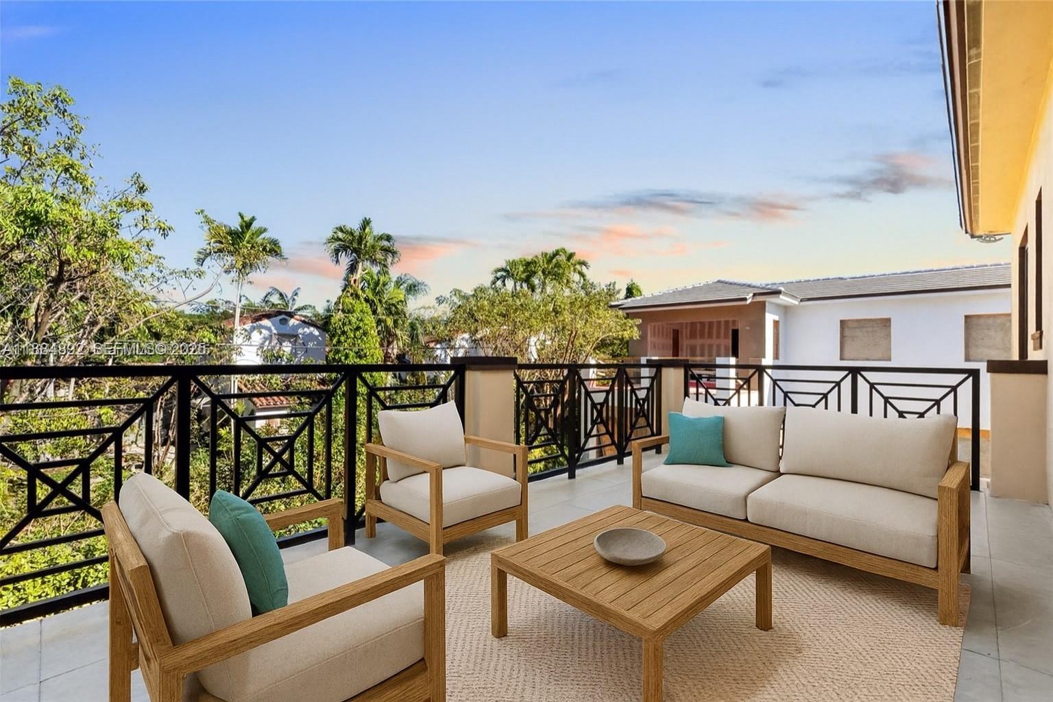 2523 Red Road Miami, FL 33134 - Photo 25 of 39 a balcony with table and chairs