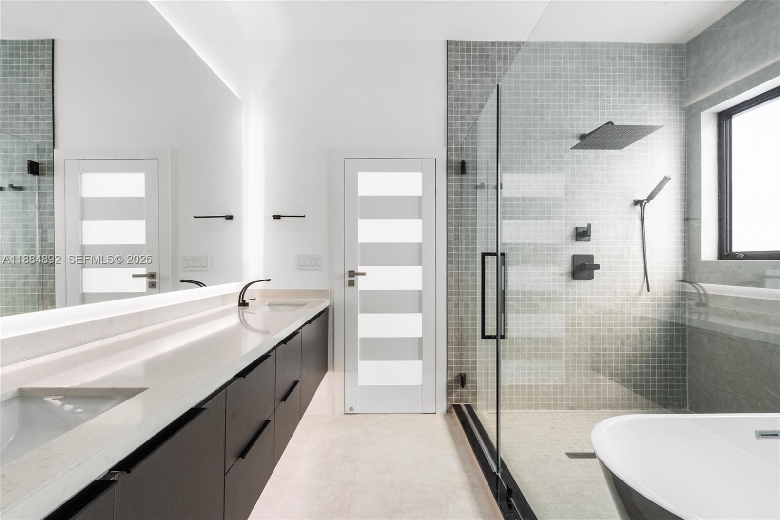 2523 Red Road Miami, FL 33134 - Photo 27 of 39 a large bathroom with a tub shower and sink