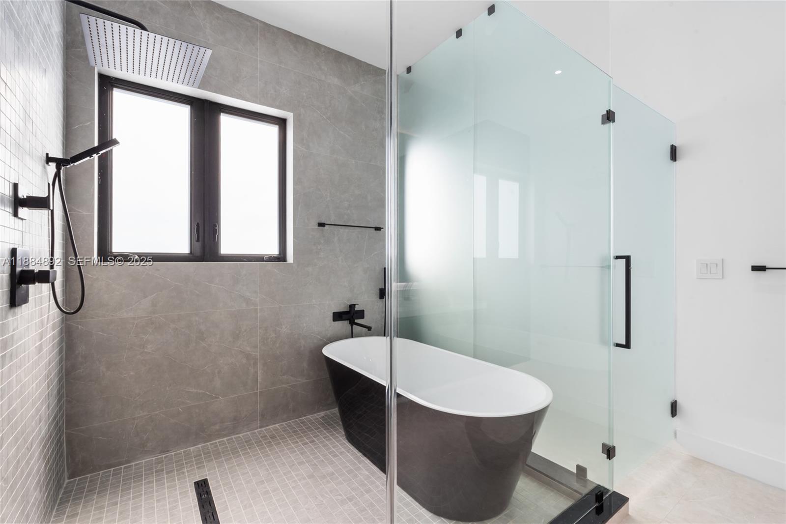 2523 Red Road Miami, FL 33134 - Photo 28 of 39 a bathroom with a sink and a mirror