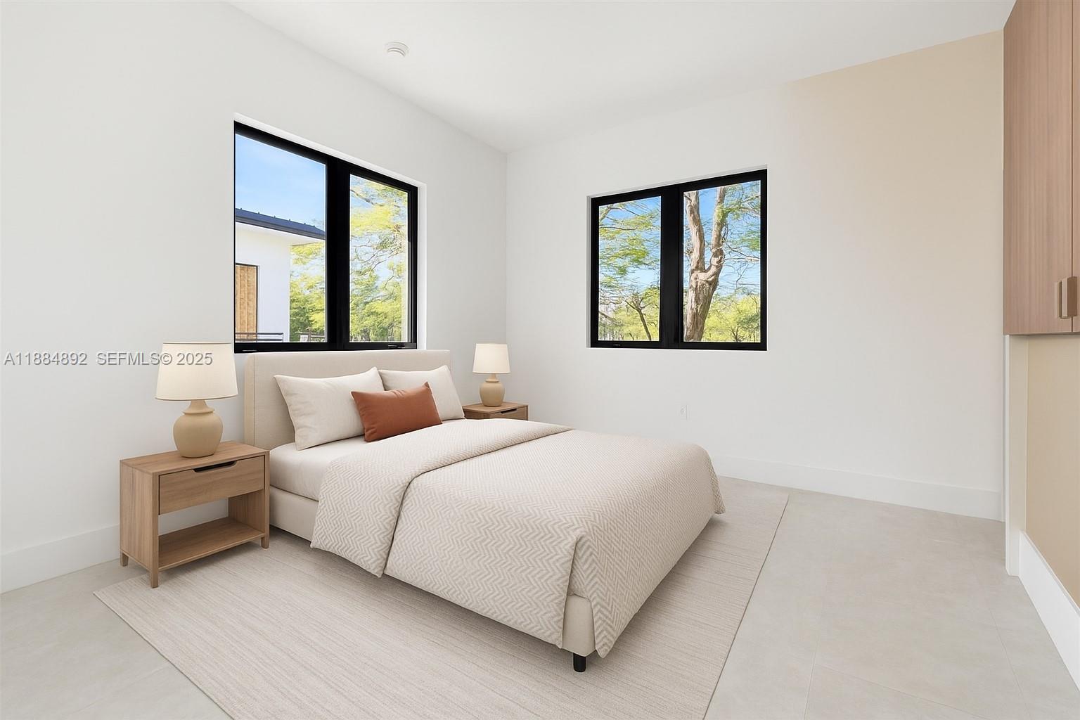 2523 Red Road Miami, FL 33134 - Photo 30 of 39 a bedroom with a bed and a large window