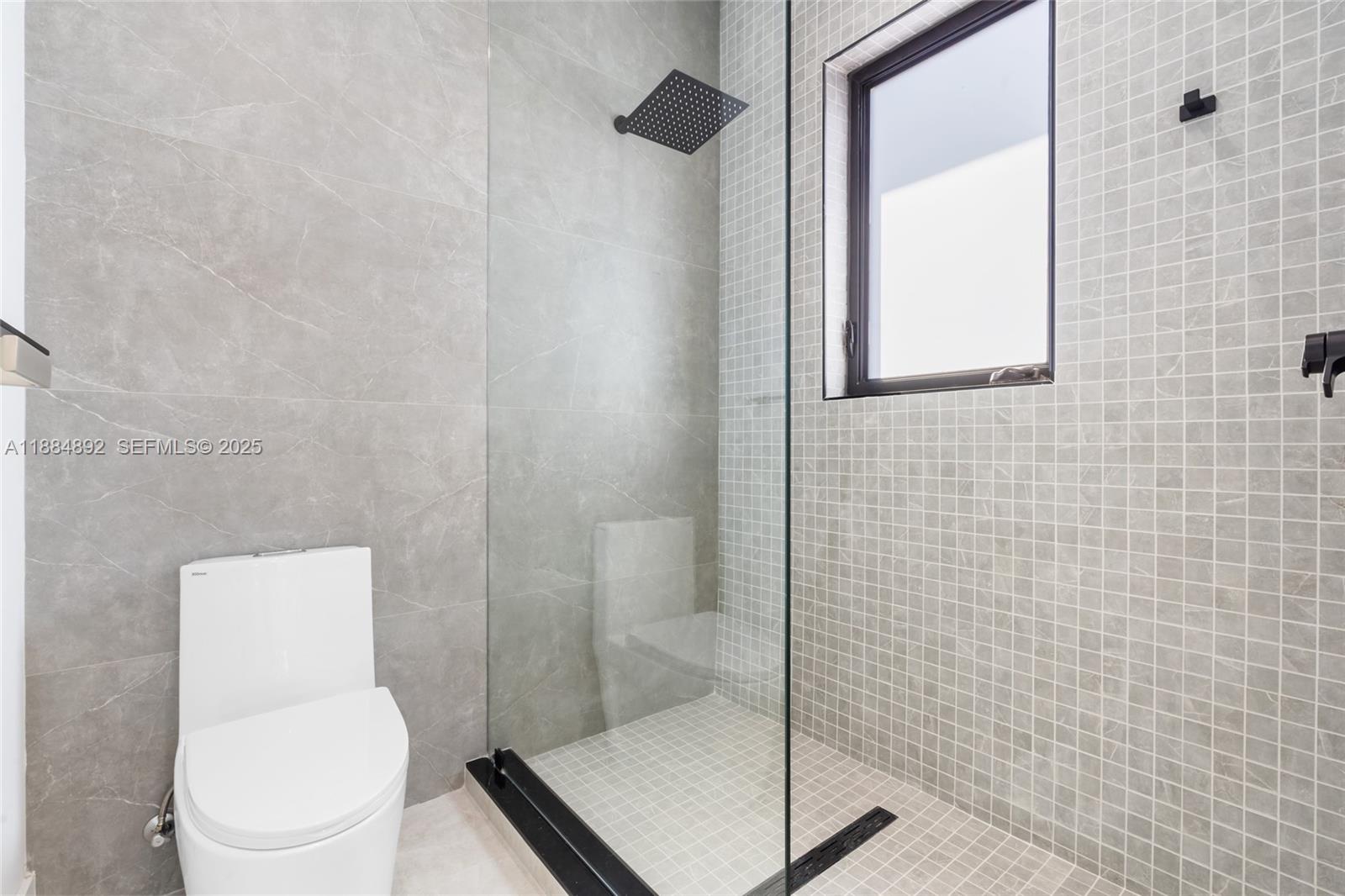 2523 Red Road Miami, FL 33134 - Photo 33 of 39 a white toilet sitting next to a bathroom sink