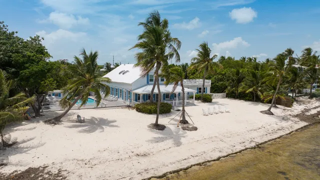 a view of a house with a yard and garden