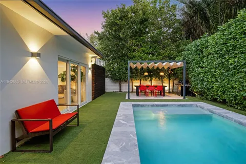 a view of swimming pool with a patio