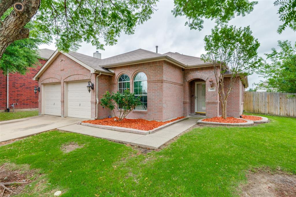 107 Bowie Street Forney, TX 75126 - Photo 1 of 25 a front view of a house with a yard and garage