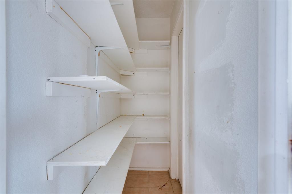 107 Bowie Street Forney, TX 75126 - Photo 13 of 25 a view of a hallway with storage
