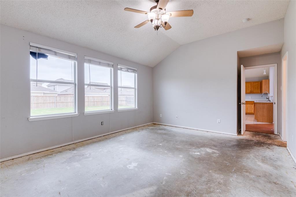 107 Bowie Street Forney, TX 75126 - Photo 14 of 25 a view of an empty room with a window