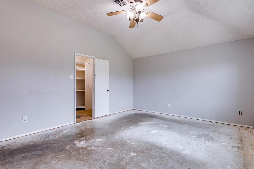 107 Bowie Street Forney, TX 75126 - Photo 16 of 25 a view of an empty room with a chandelier fan