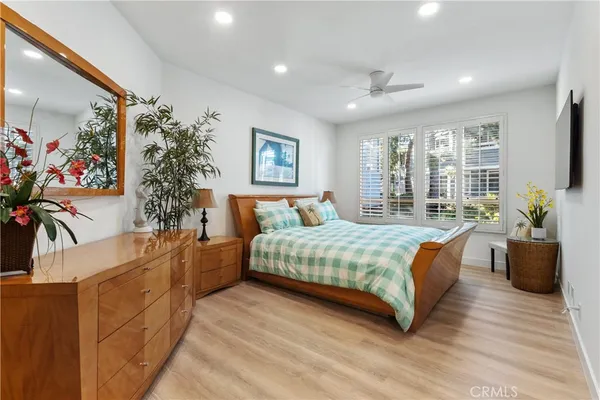 a spacious bedroom with a large bed and a couch