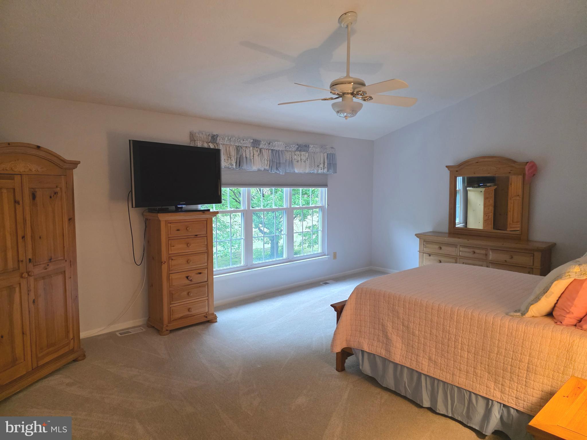 2441 Kemper Road Crofton, MD 21114 - Photo 41 of 63 a bedroom with a bed and a television