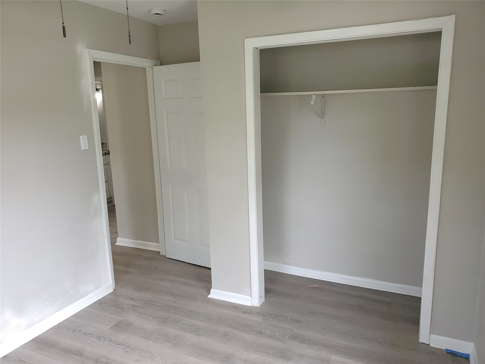 8907 Shepard Drive Austin, TX 78753 - Photo 11 of 14 an empty room with wooden floor and closet area