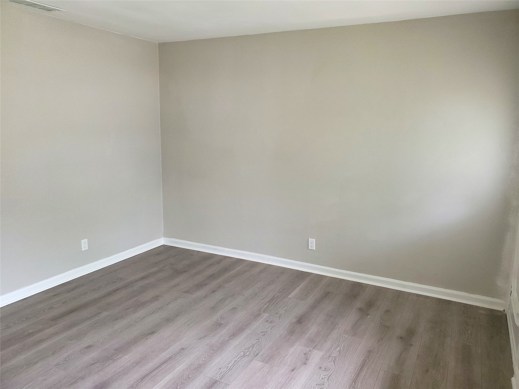 8907 Shepard Drive Austin, TX 78753 - Photo 4 of 14 a view of an empty room with wooden floor
