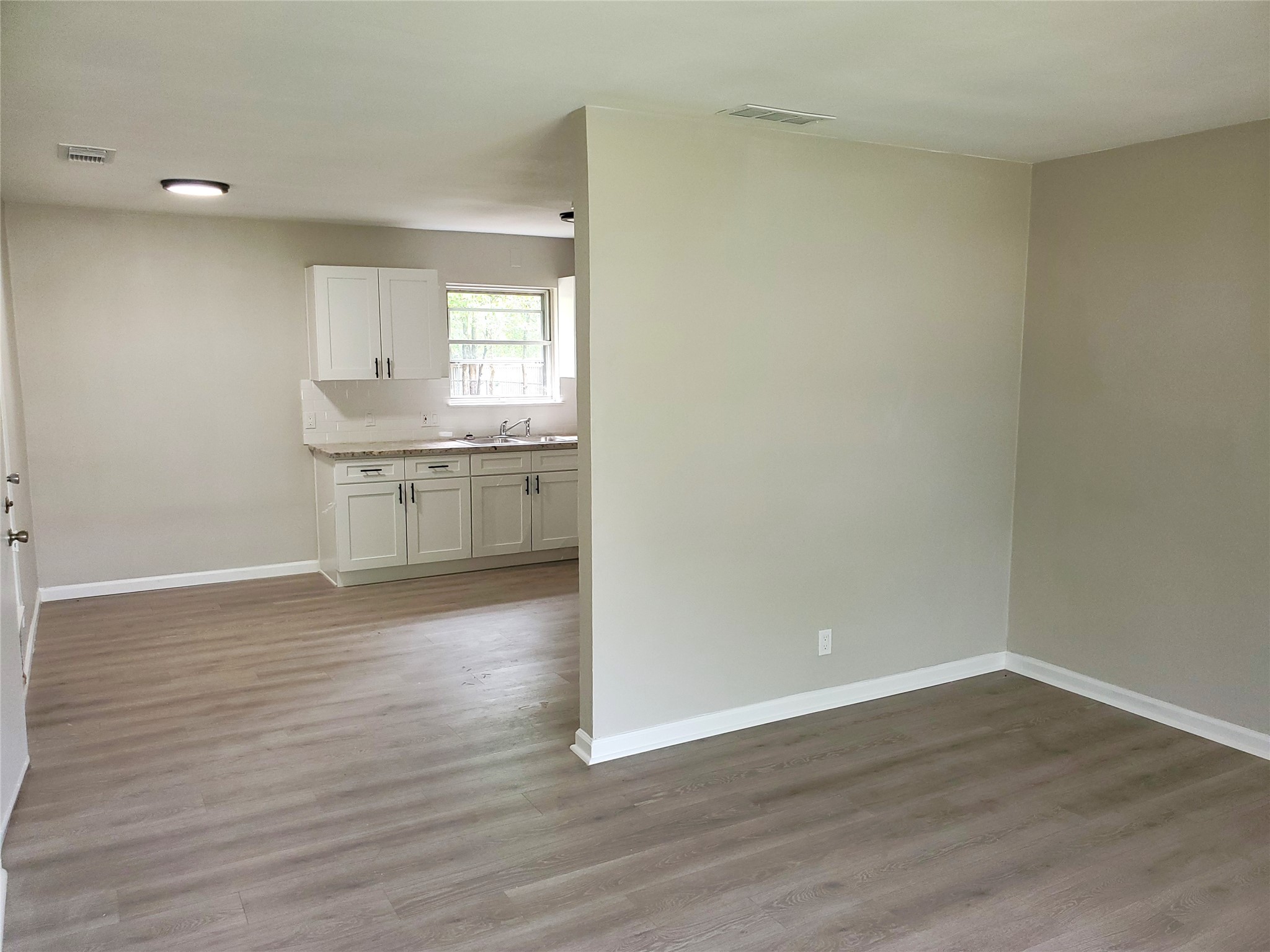8907 Shepard Drive Austin, TX 78753 - Photo 5 of 14 a view of kitchen and wooden floor