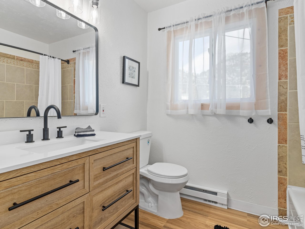 1873 Ranch Circle Estes Park, CO 80517 - Photo 12 of 33 Renovated Main Level Full Bath With New Vanity and Tiled Shower