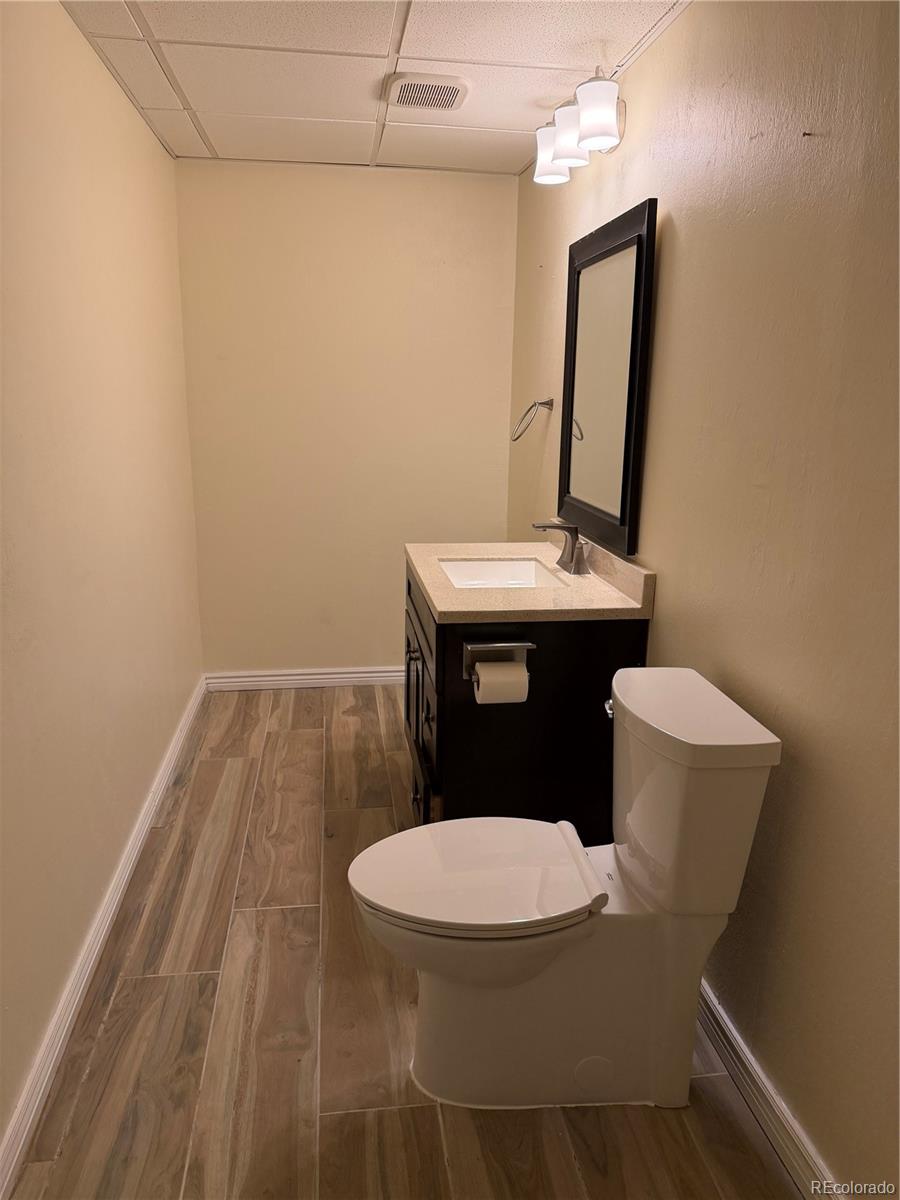 6369 Cole Lane Arvada, CO 80004 - Photo 14 of 21 a bathroom with a toilet and a sink