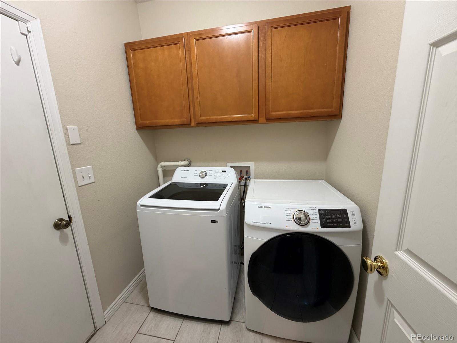 6369 Cole Lane Arvada, CO 80004 - Photo 15 of 21 a utility room with dryer and washer