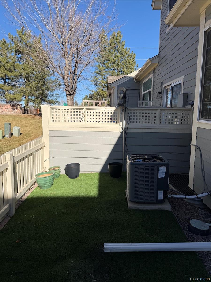 6369 Cole Lane Arvada, CO 80004 - Photo 18 of 21 a view of a house with a yard