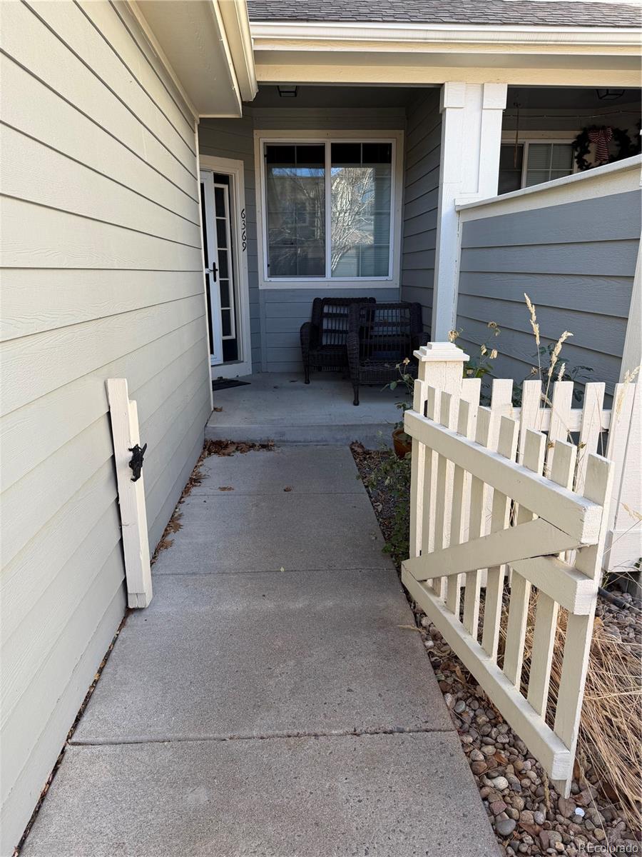 6369 Cole Lane Arvada, CO 80004 - Photo 7 of 21 a view of front door of house