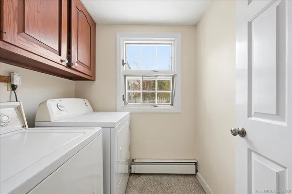 a bedroom with a bed and a lamp