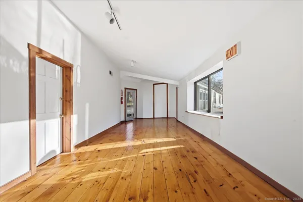a bedroom with bed and window