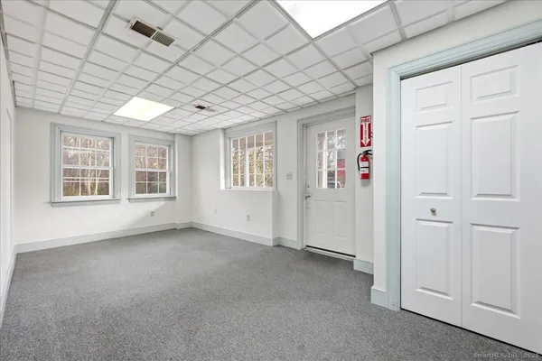 a view of a big room with closet and mirrors