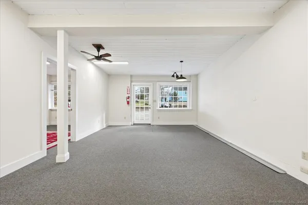 a view of an empty room with a window