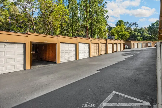 an aerial view of residential house with outdoor space and swimming pool