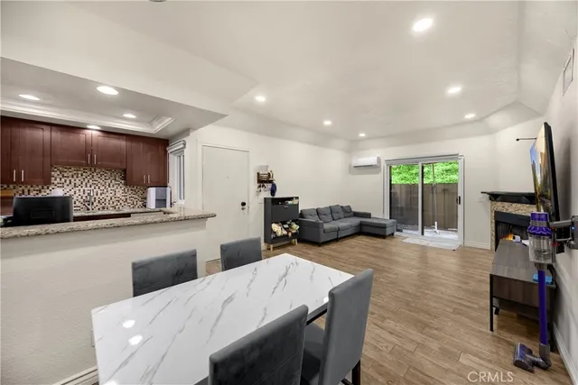 a kitchen with stainless steel appliances granite countertop a refrigerator sink and cabinets