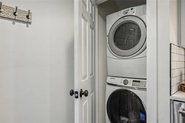 a view of a hallway with washer and dryer