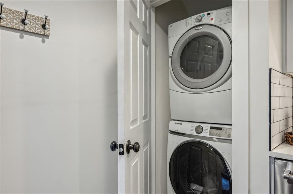 21 Willow Woods Road Social Circle, GA 30025 - Photo 11 of 49 a view of a hallway with washer and dryer