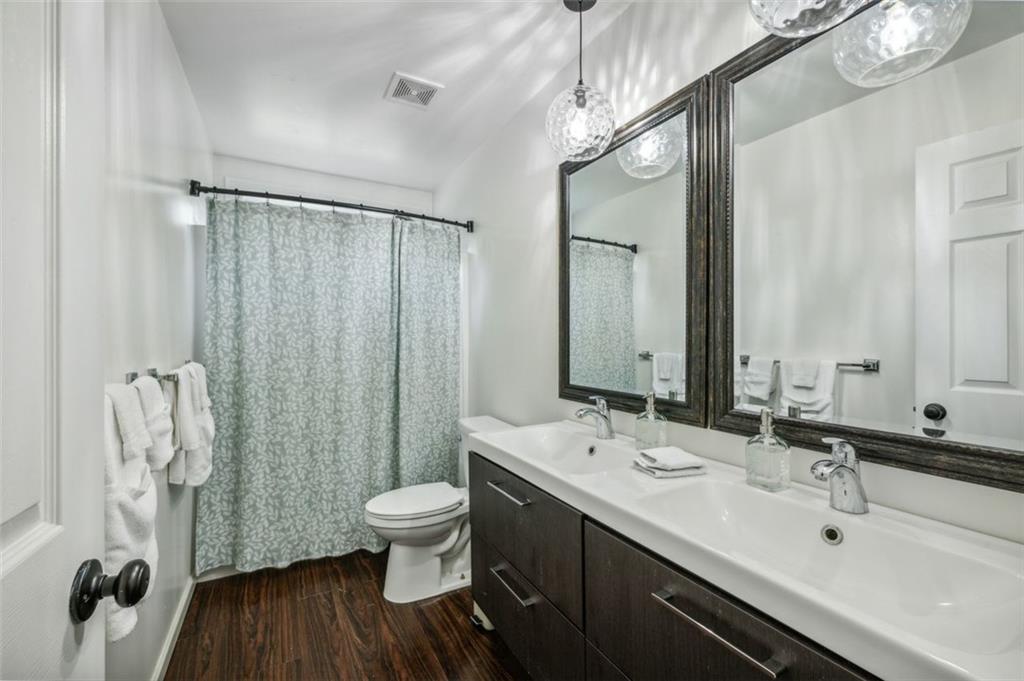21 Willow Woods Road Social Circle, GA 30025 - Photo 25 of 49 a bathroom with a double vanity sink toilet and shower