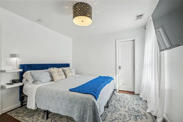 a bedroom with a bed and a window