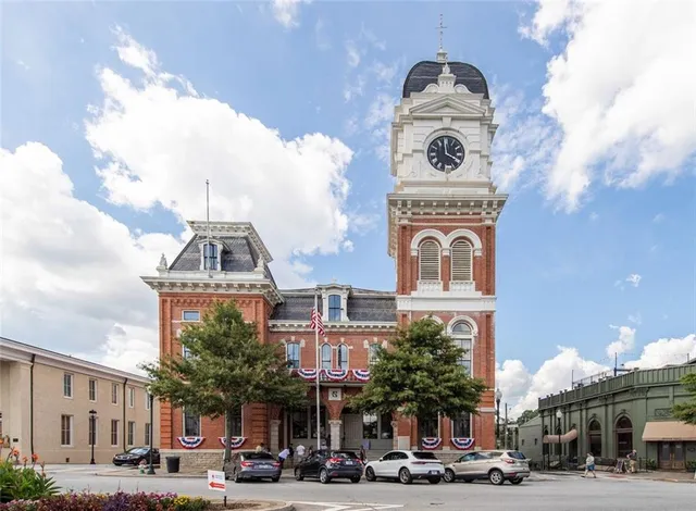 a view of a building with sitting area