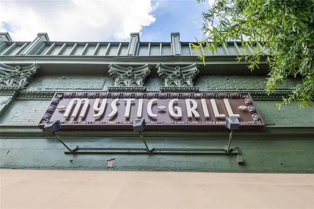 a view of a building with car parked