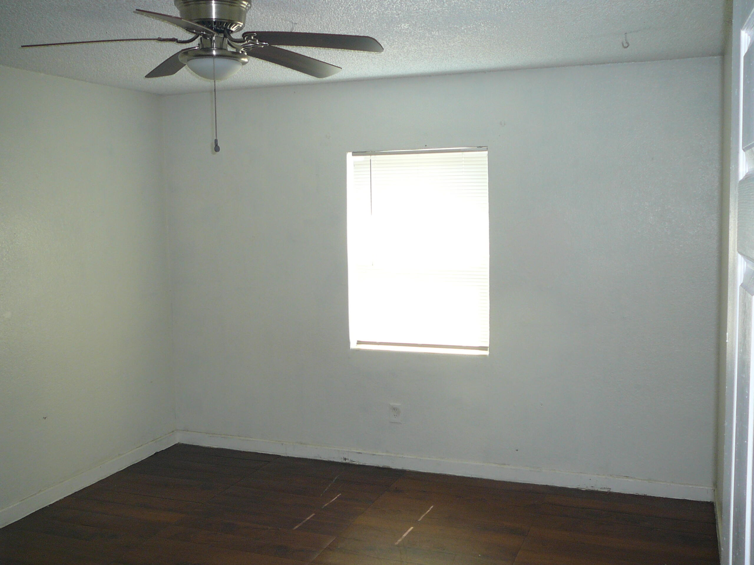512 South 25th Street Fort Pierce, FL 34950 - Photo 11 of 17 an empty room with a window