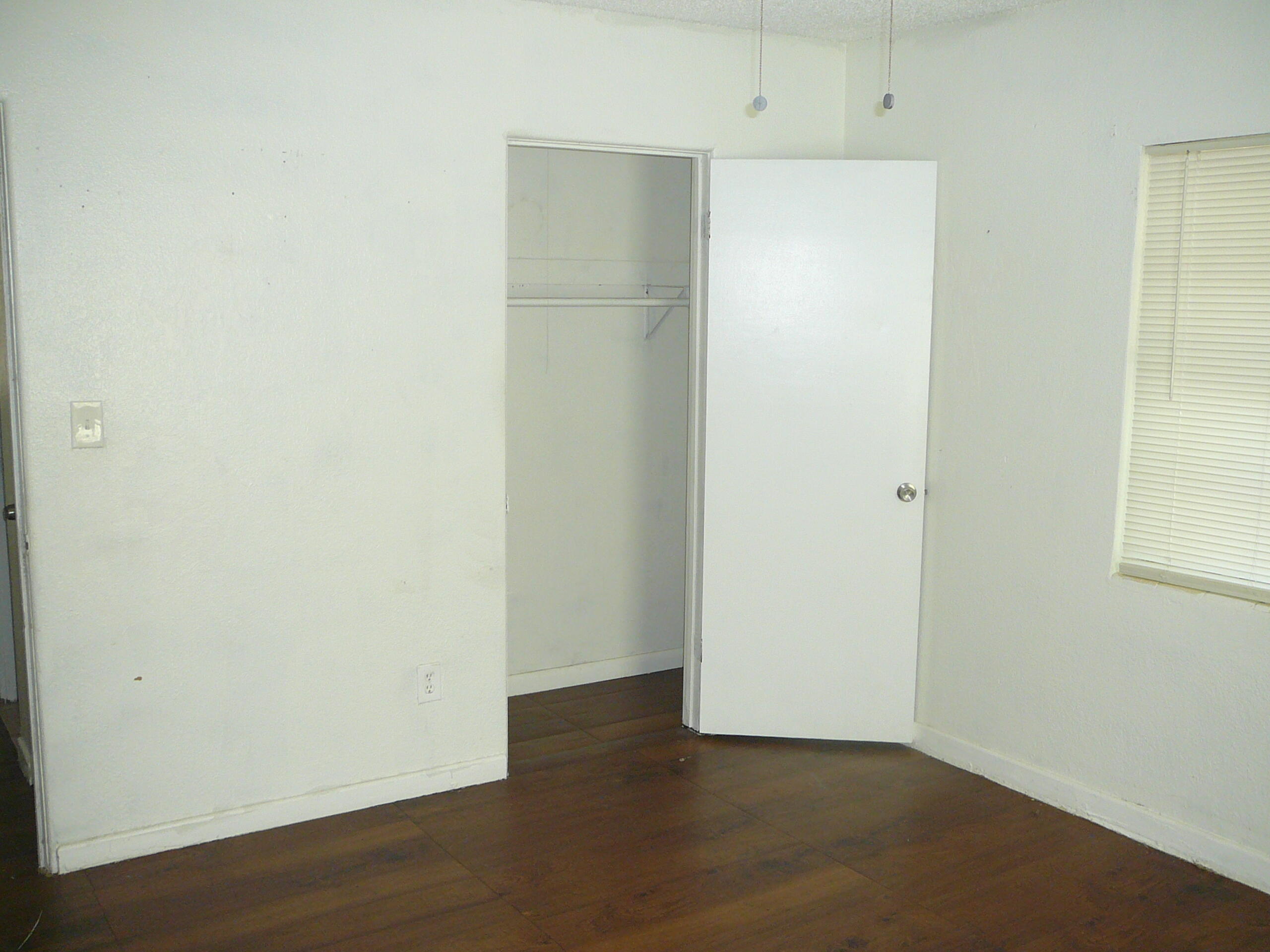 512 South 25th Street Fort Pierce, FL 34950 - Photo 12 of 17 an empty room with wooden floor