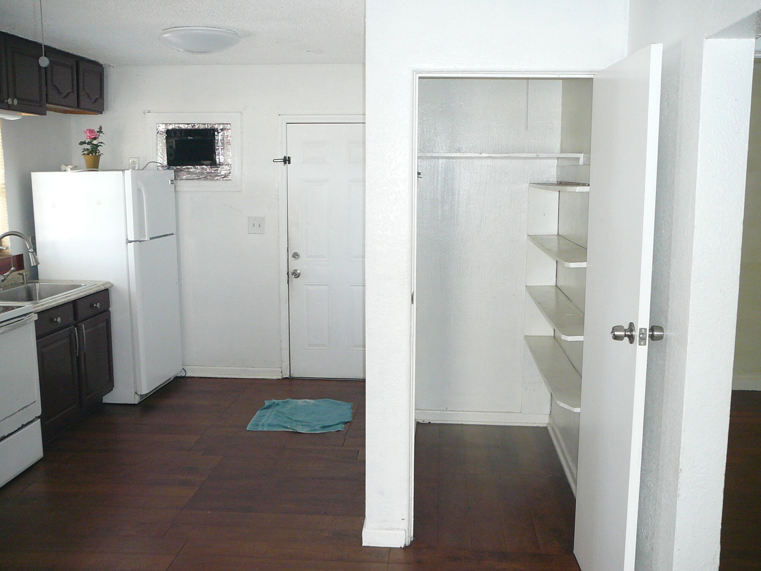 512 South 25th Street Fort Pierce, FL 34950 - Photo 8 of 17 a view of kitchen with furniture and refrigerator