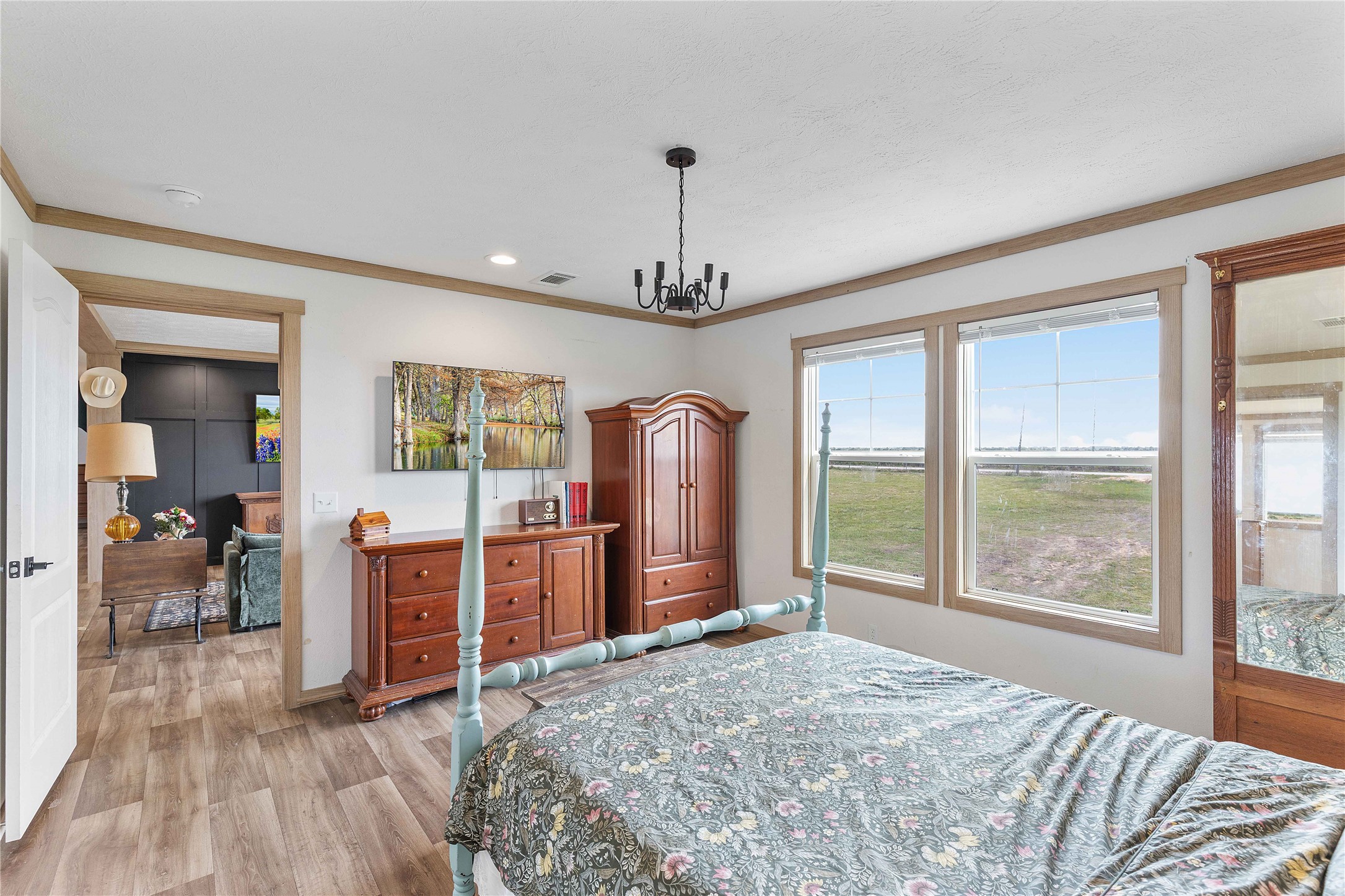 21550 Wilber Road Winnie, TX 77665 - Photo 18 of 28 a bed room with a bed and a large window