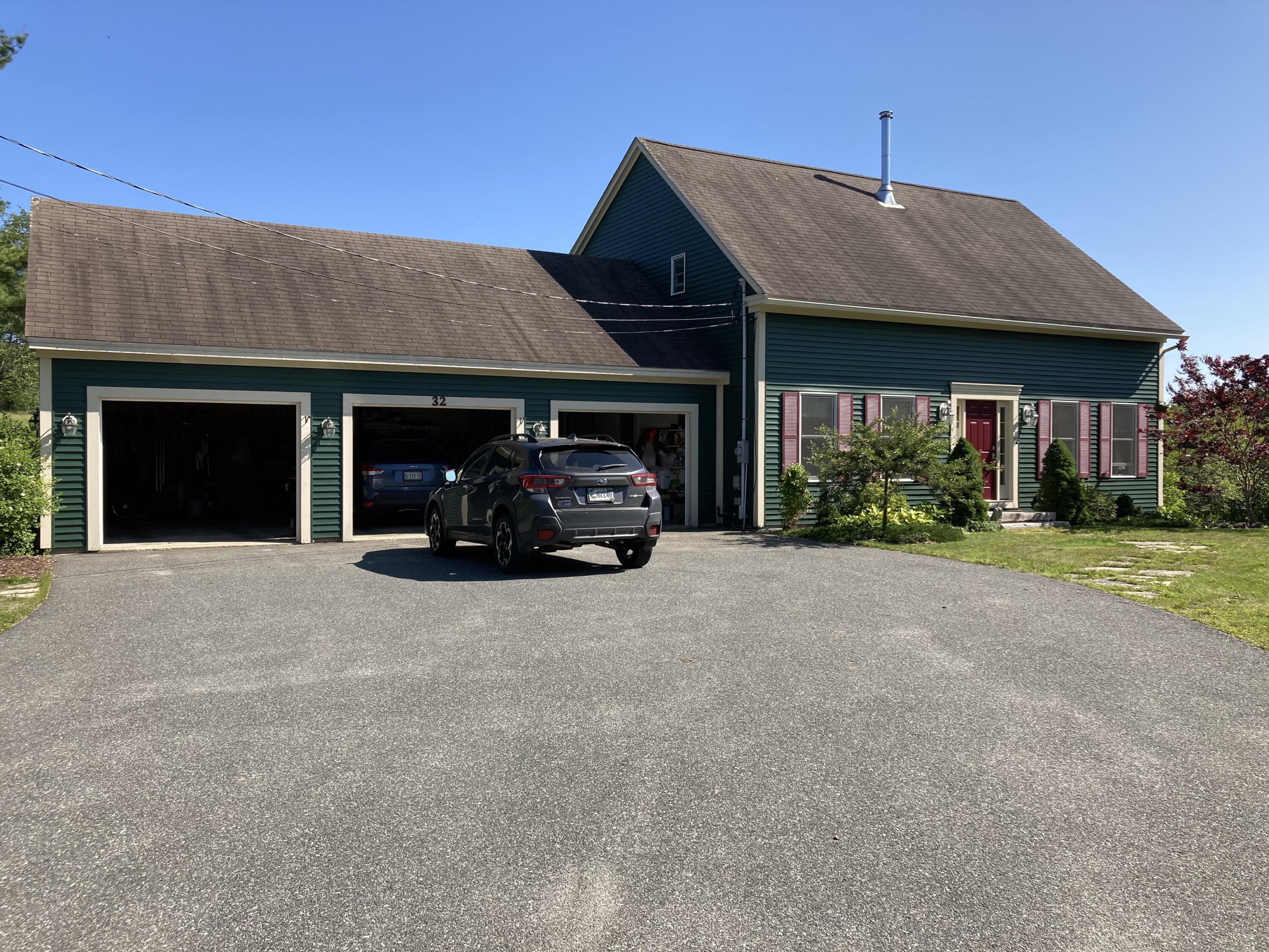 32 Boulder Cv Way Lamoine, ME 04605 - Photo 2 of 37 Three-car garage.