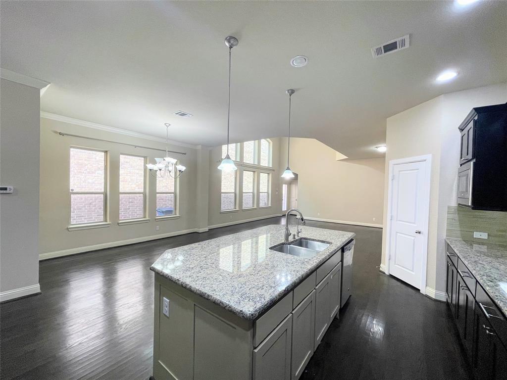 6622 DeLeon Street Irving, TX 75039 - Photo 30 of 32 a bathroom with a granite countertop sink a large mirror and vanity