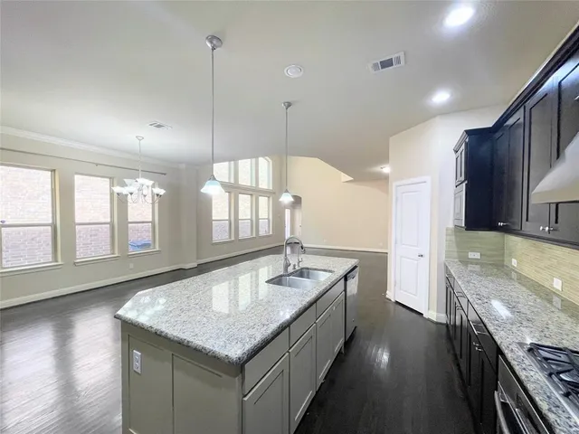 a view of a house with a yard and plants