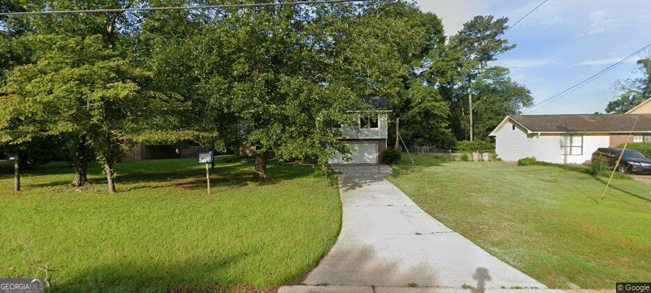 1381 Flat Rock Road Stockbridge, GA 30281 - Photo 1 of 1 a view of house with a backyard